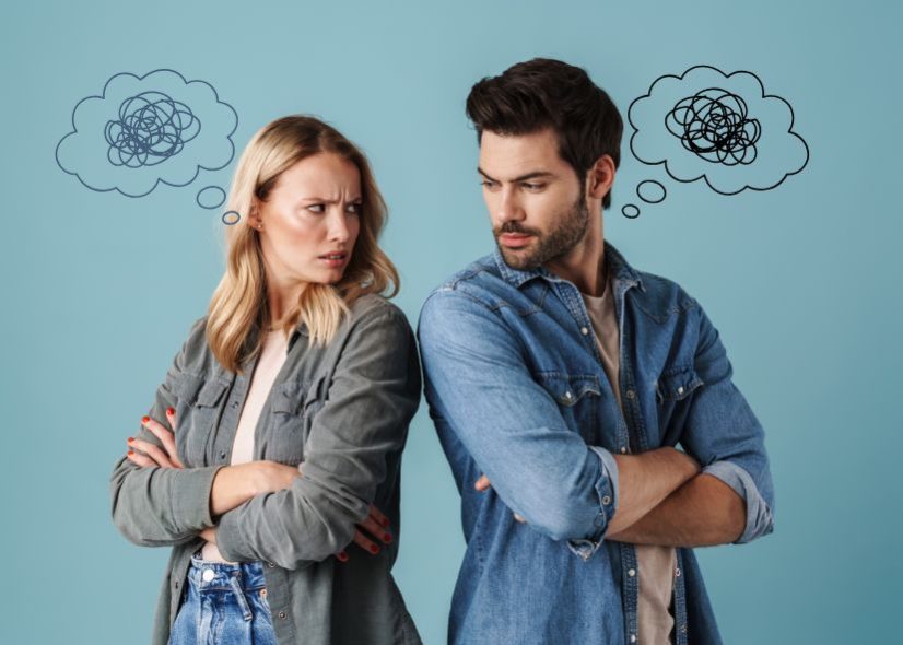 Two angry people standing back to back, offended